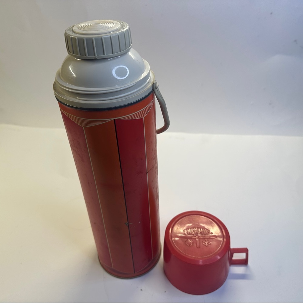 Vintage red and orange lined thermos